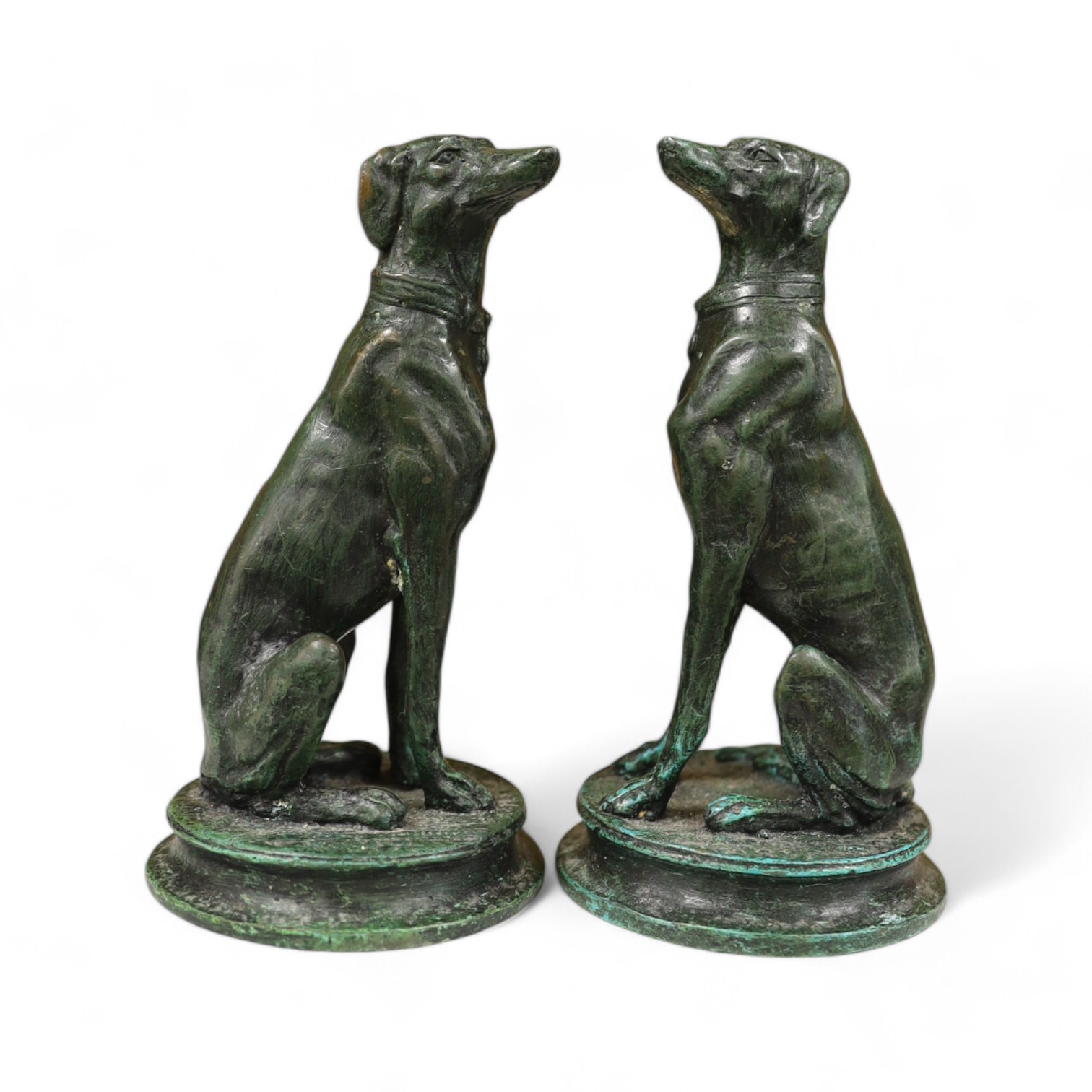 A pair of bronze seated whippets, 16.5cm high. Condition - fair